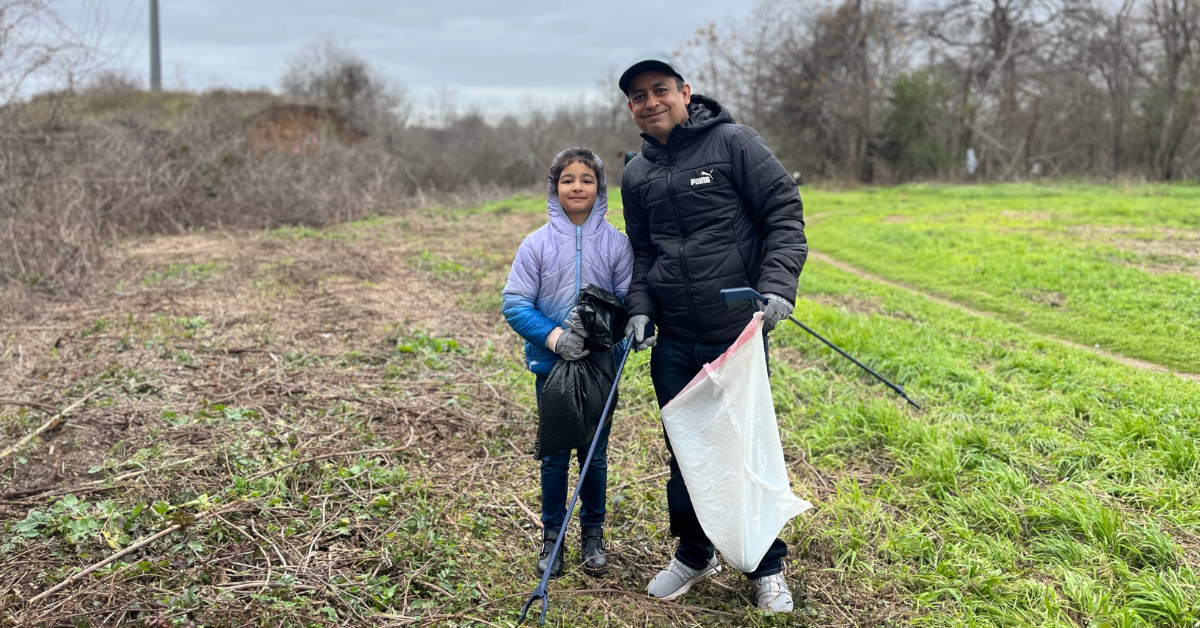 Father and daughter volunteering at Onion Creek