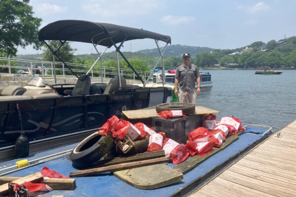 2025 Lake Austin Cleanup_Austin Rental Boats, Shawn Smith, unloads trash and debris at Walsh Landing