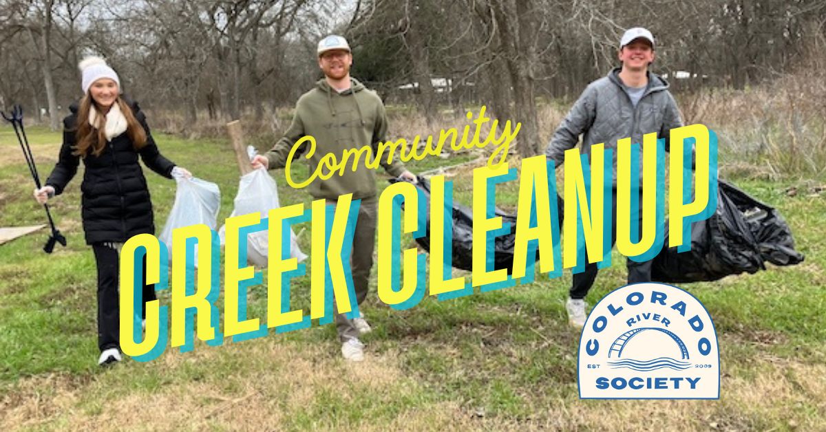 volunteers holding trash bags during a community creek cleanup with CRA River Society logo