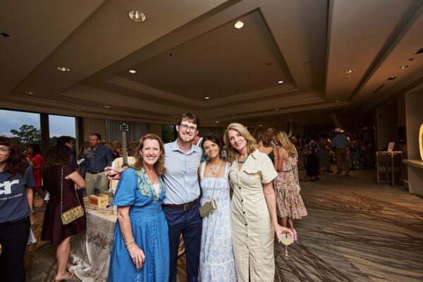 group of guests posing together at the cocktail reception