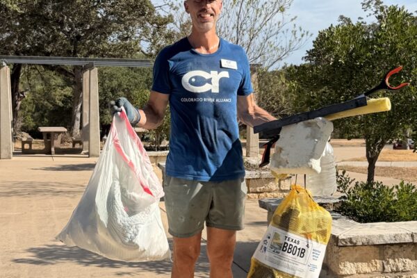 2026-cra-lake-travis-cleanup-volunteer-with-bags_1200p